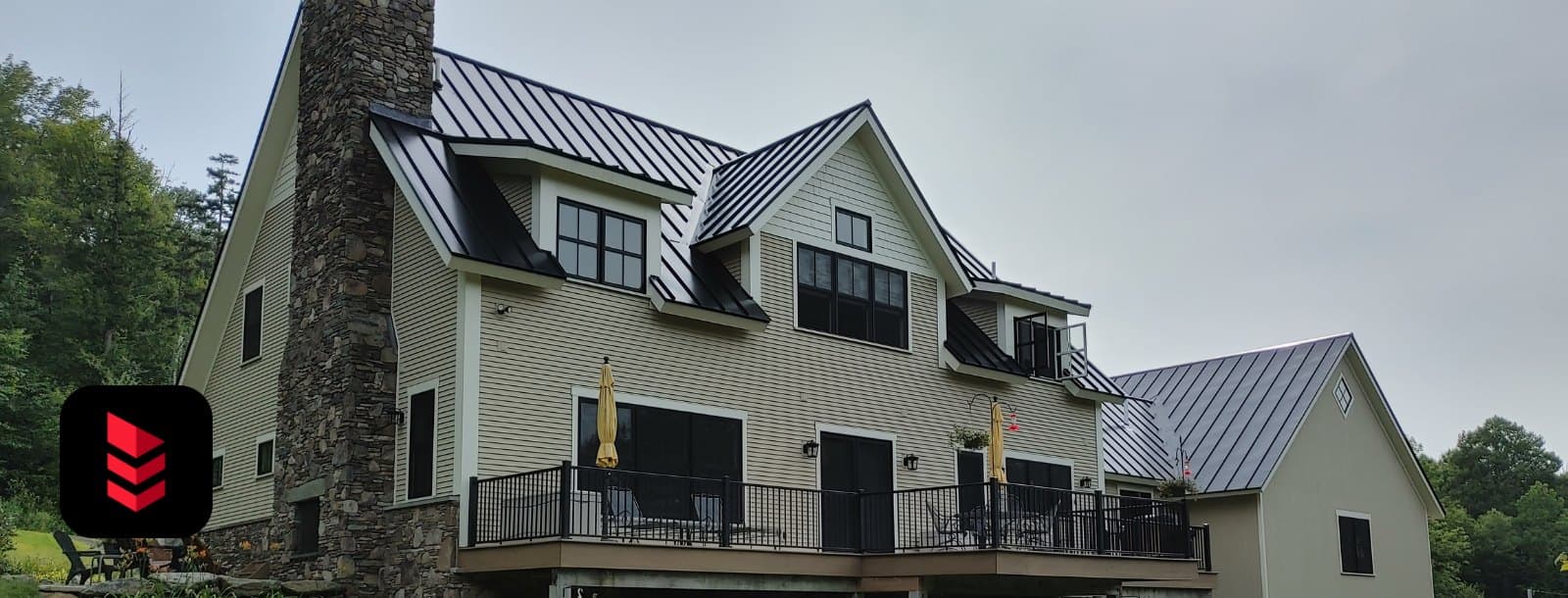 Home with a finished black Metal Sales standing-seam metal roof