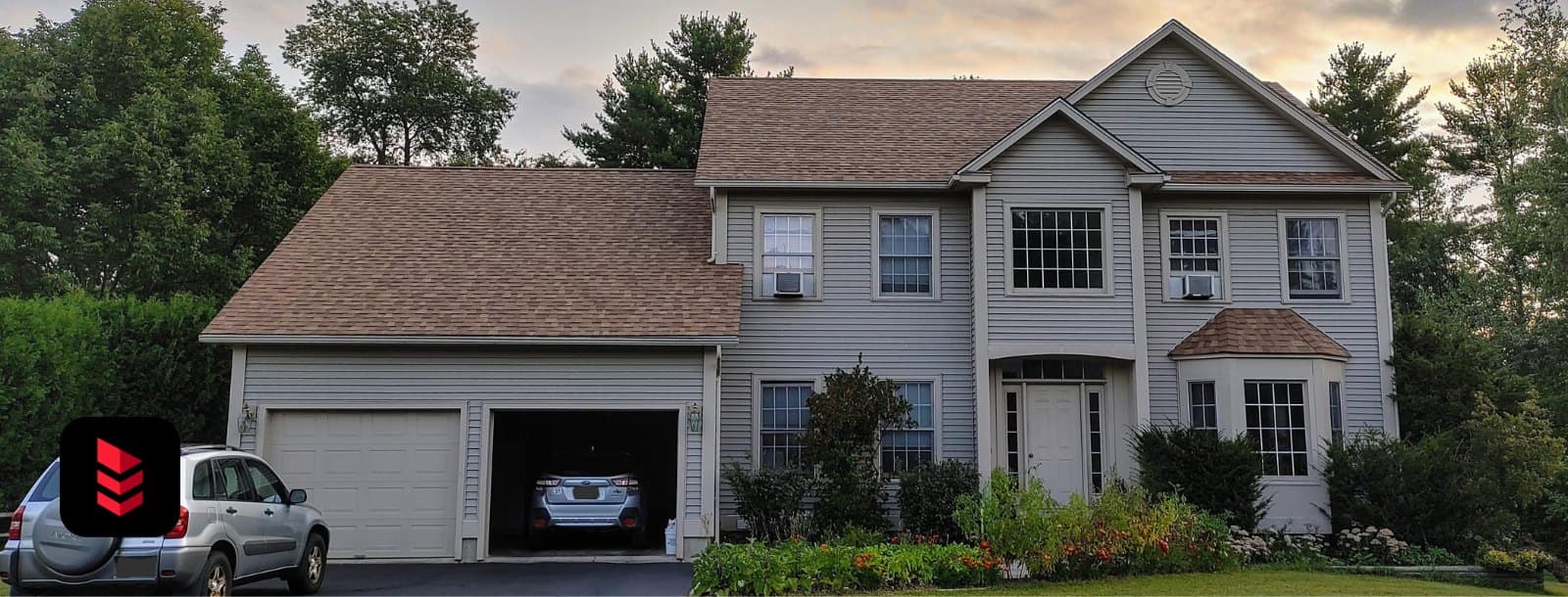 Colonial home with a new Owens Corning Duration Brownwood shingle roof